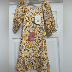 Ivy City Co Mini Maya Dress with Yellow and Orange Floral Pattern